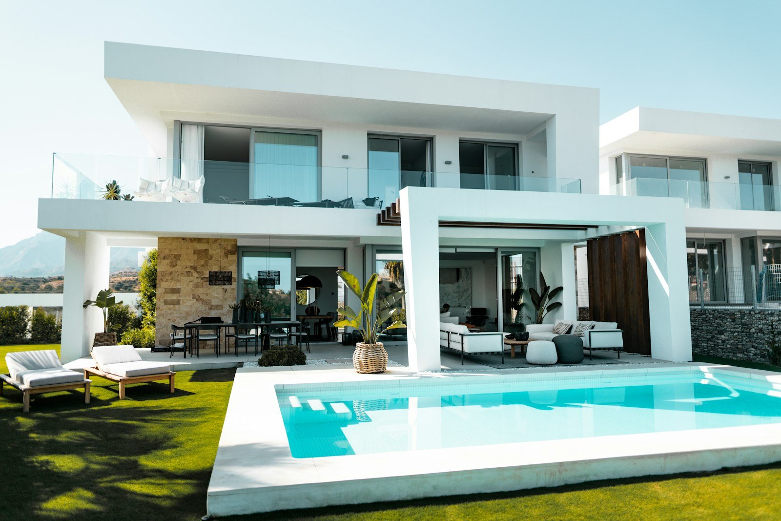 Private villa exterior with pool and landscaped garden